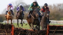 A race in which horses must jump over fences and ditches