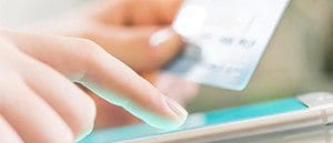 A Visa customer entering card details on a smartphone